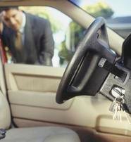 Locksmith unlocking a car door